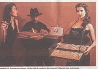 Boston Herald photo of cigar roller with cigar waitress